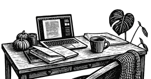 Desk with laptop and notebook